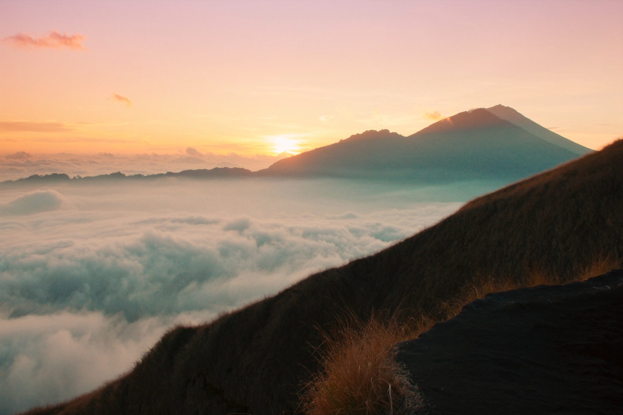 Amber dusk over the caldera from the summit of Mount Batur
