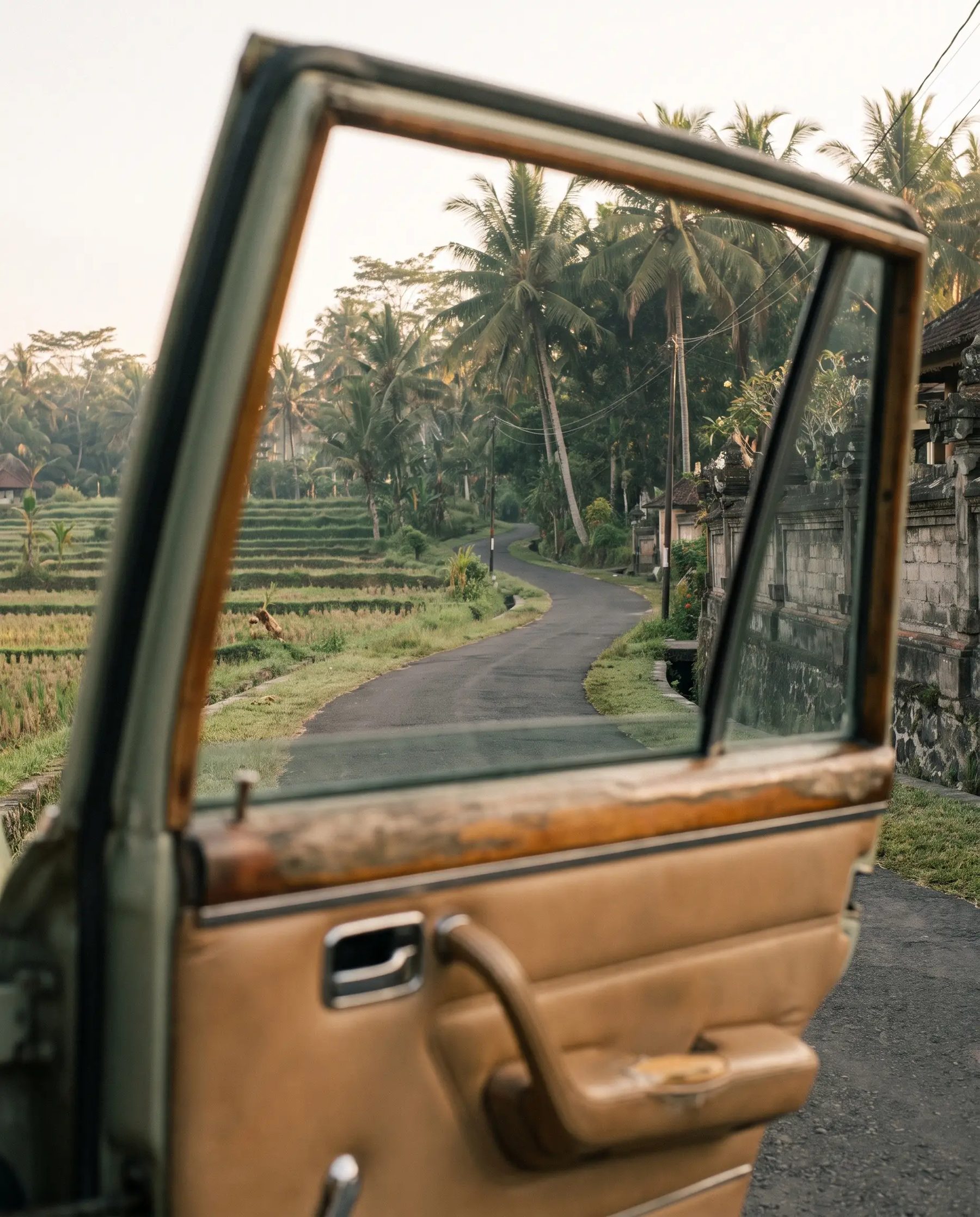 The view from a car on the quiet road up to Ubud through the rice terraces