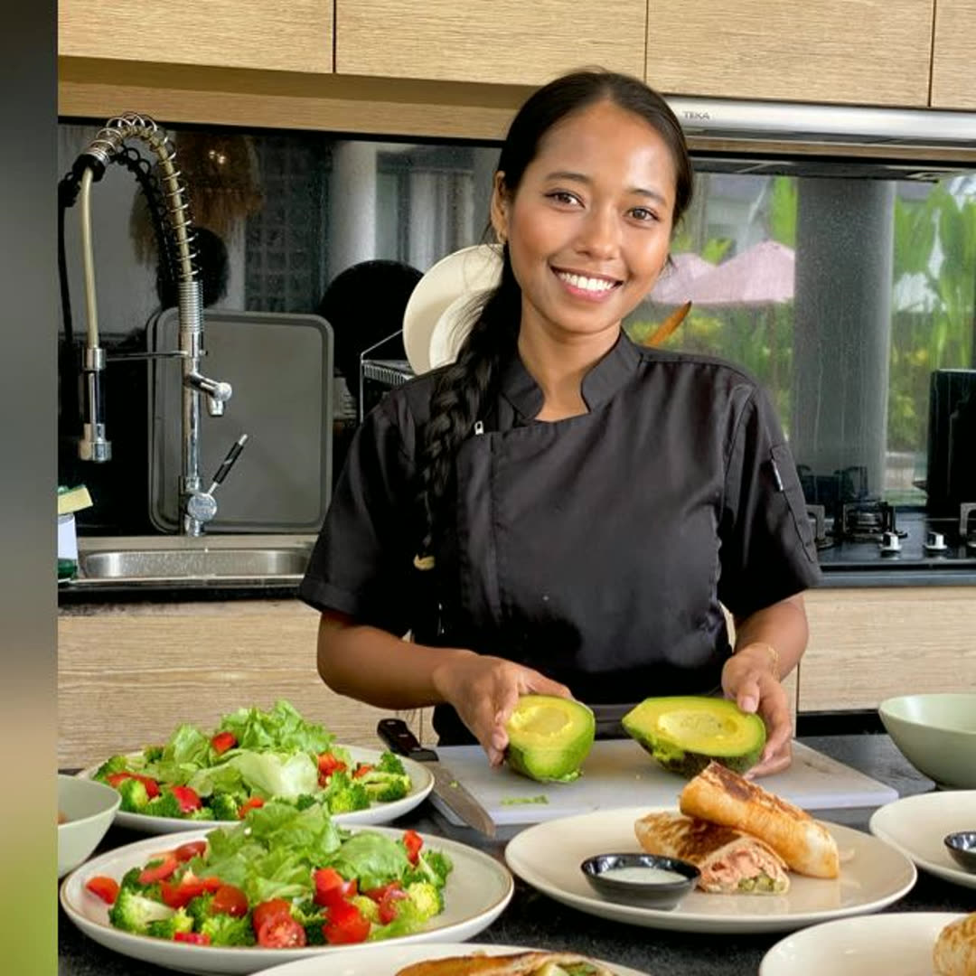 Fanny, executive chef at Moon and Spoon, preparing lunch in a villa kitchen