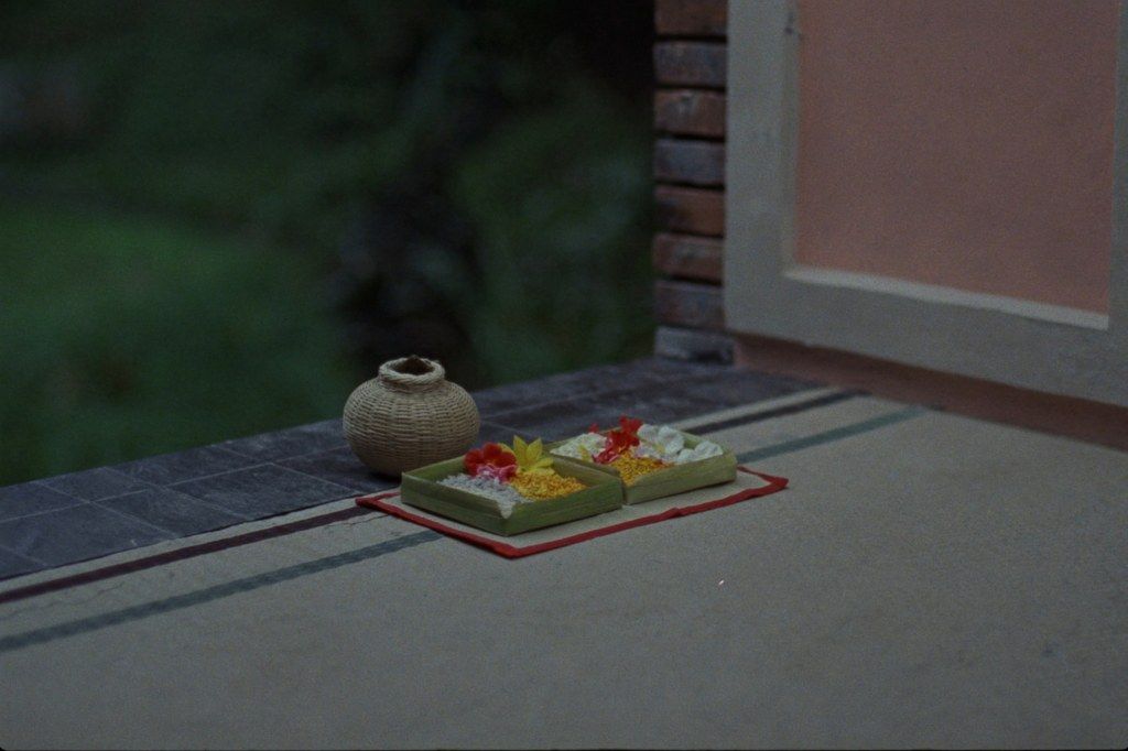 Canang sari palm leaf offerings with flowers