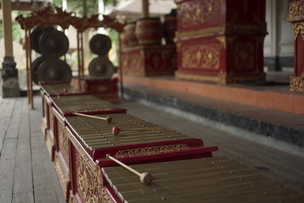Bronze gamelan keys and mallets in a village bale