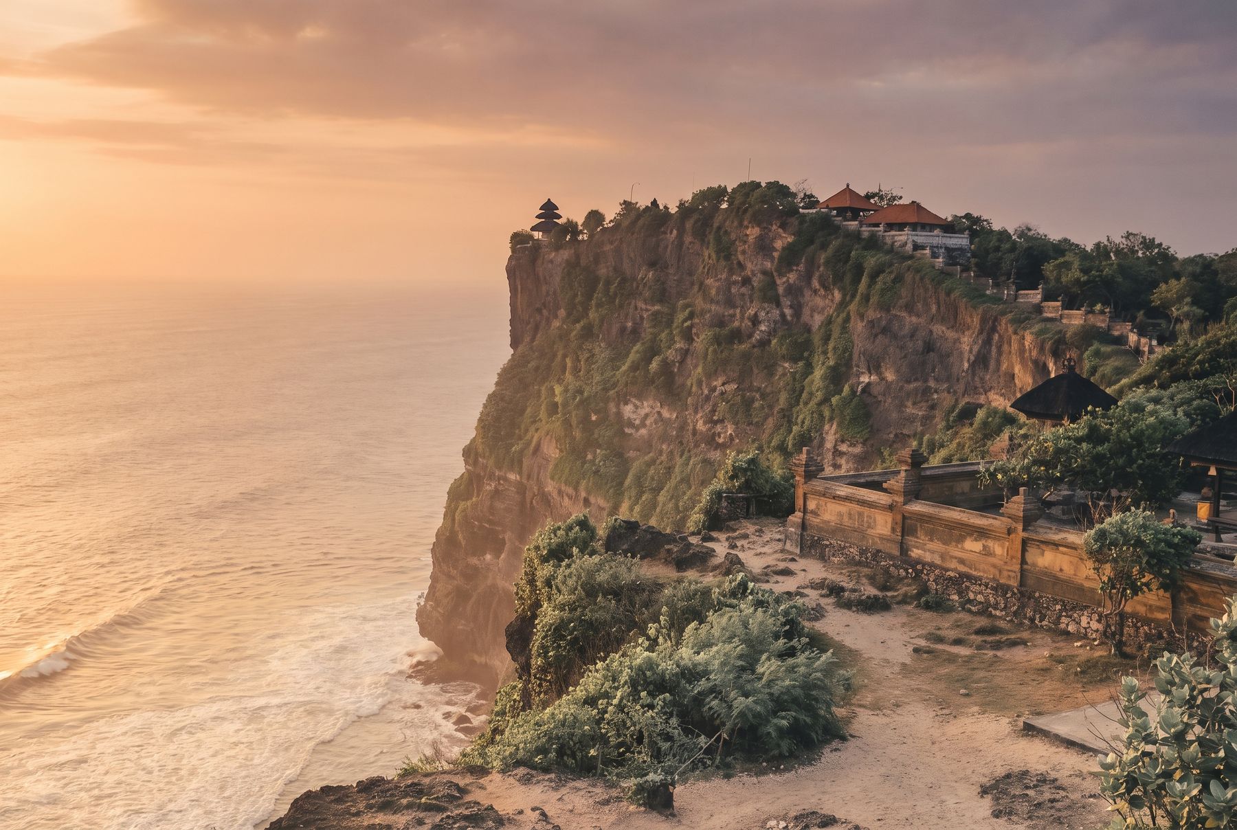 The Uluwatu cliff temple above the sea at sunset